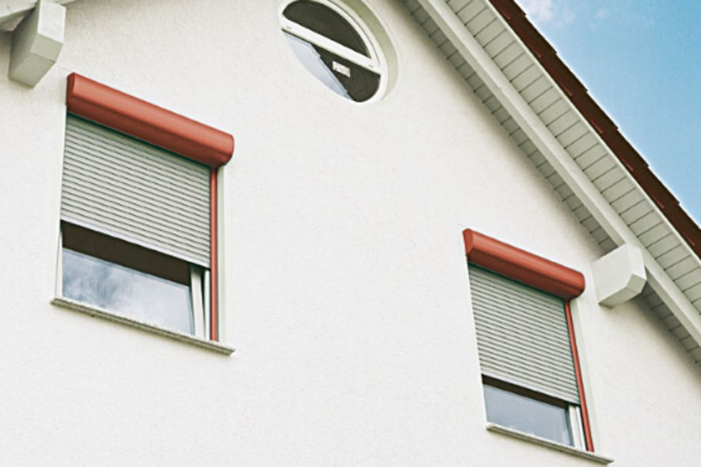 Front mounted roller shutter with insect protection