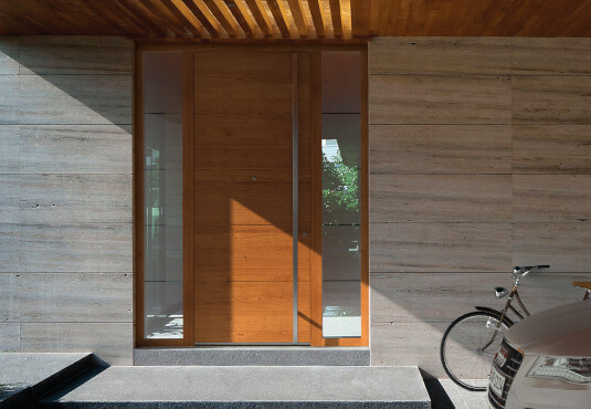 Wooden front door with glass