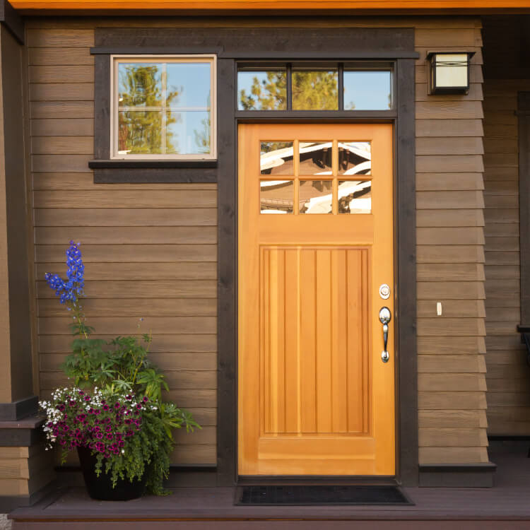 Wooden front door with top light