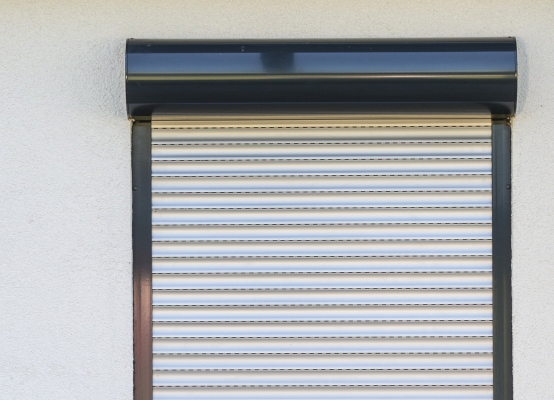 Front mounted roller shutters