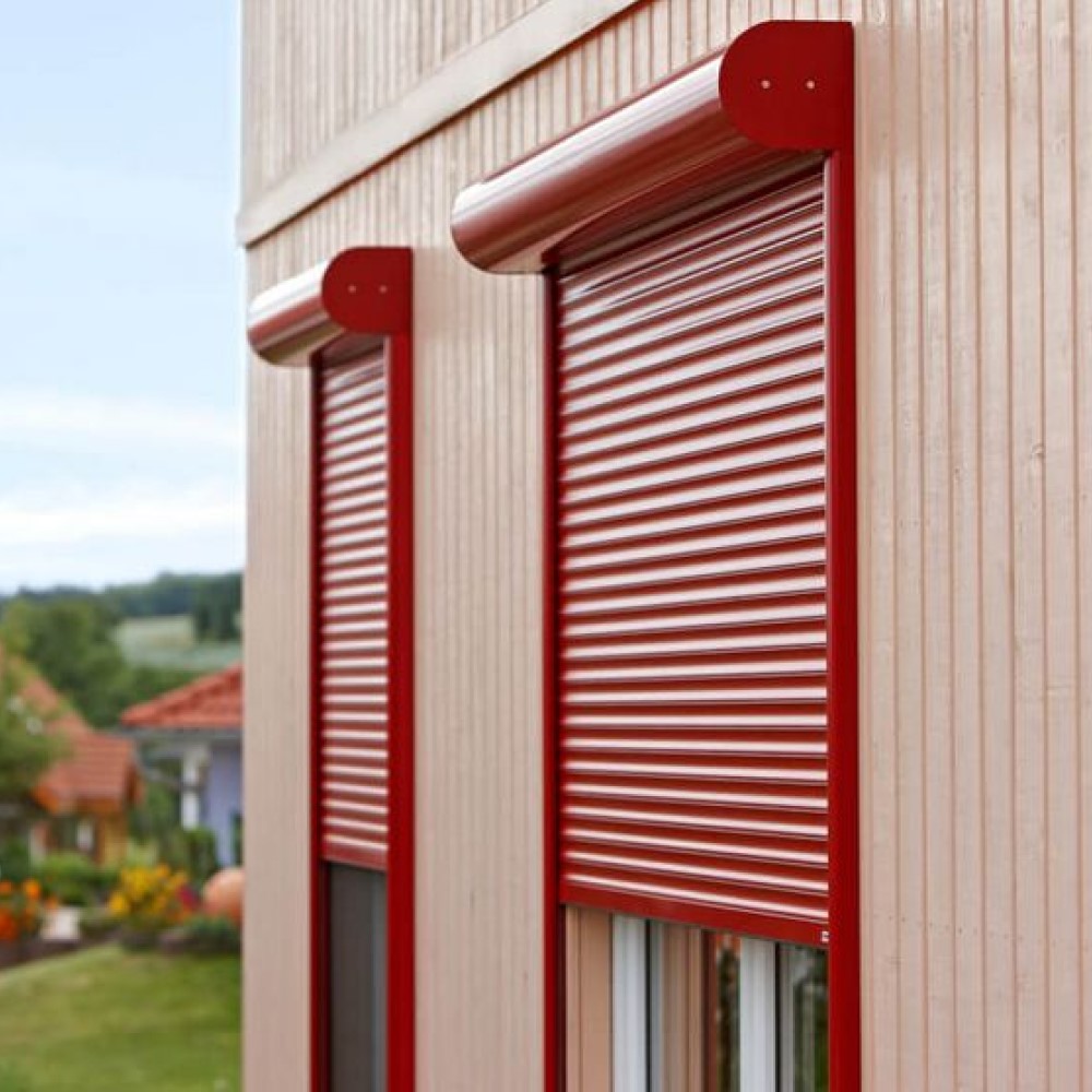 Red front-mounted roller shutters with round box