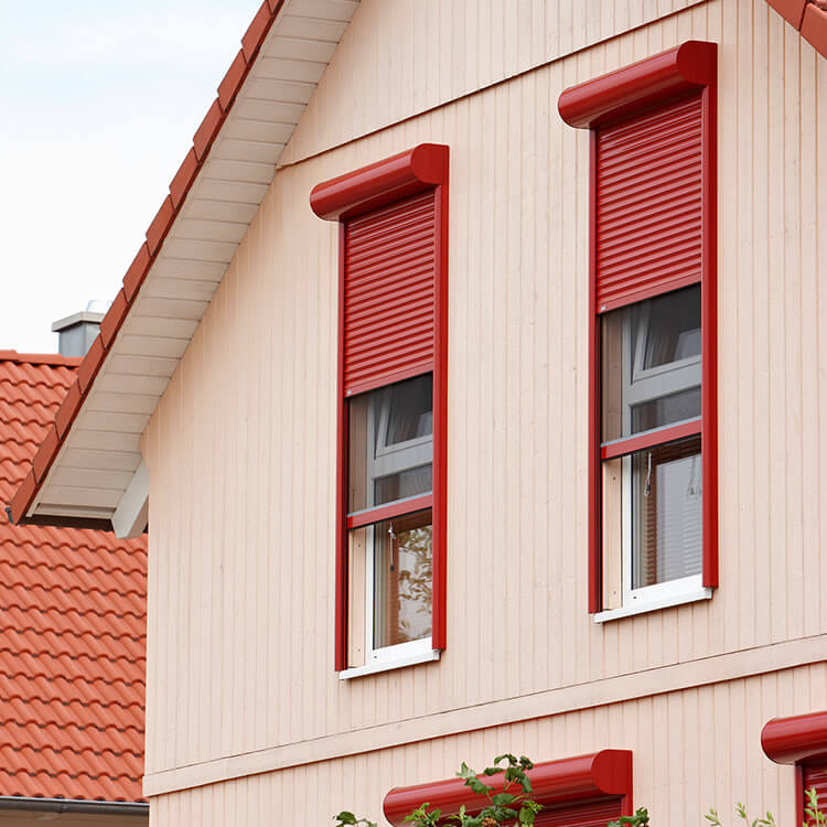 Red front mounted roller shutter in its fitting position