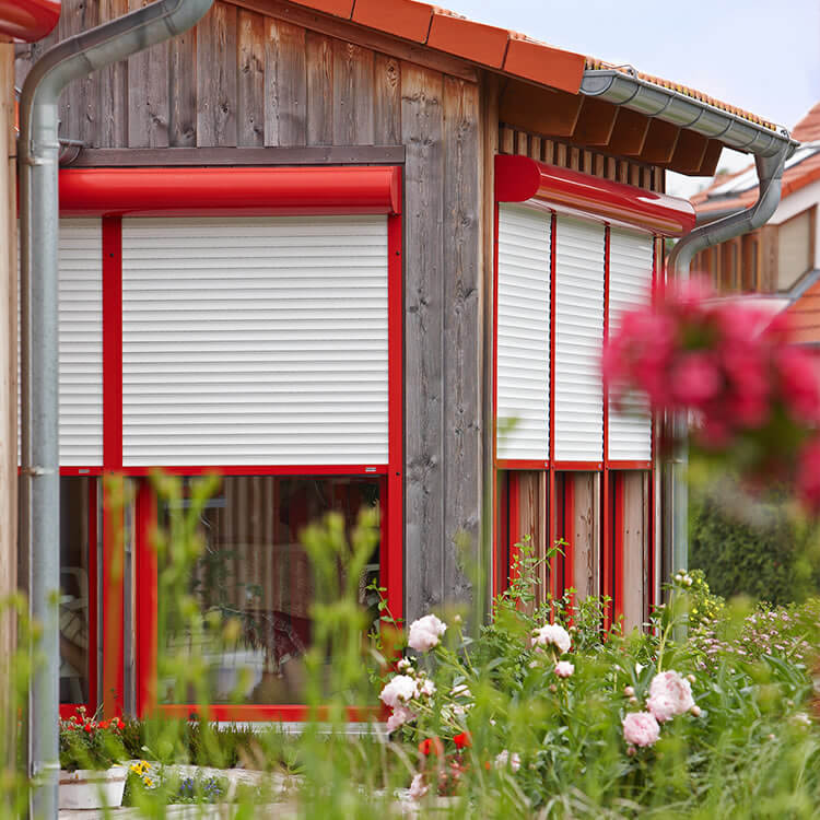 Front mounted roller shutter box in red