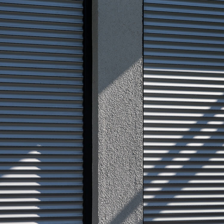 Front mounted roller shutter slats in their fitting position