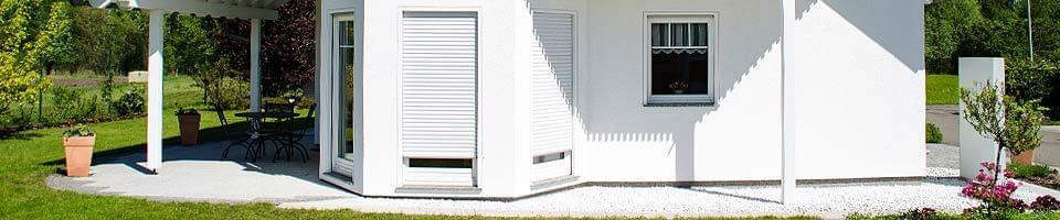 Residential house with patio door roller shutters