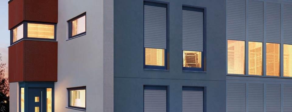 Window with top-mounted roller shutter